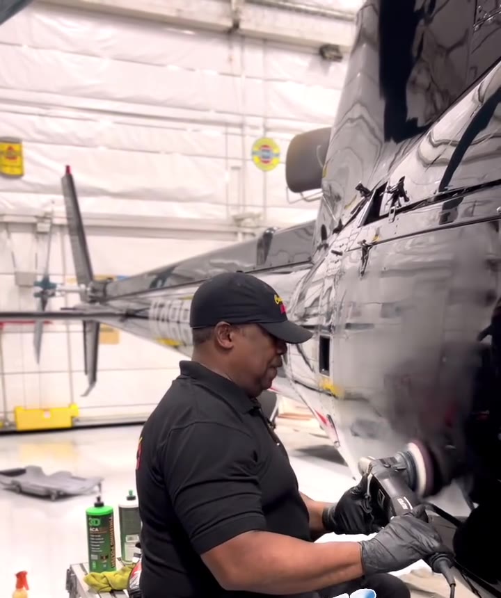 Chuck Mason polishing a finish inside a private hangar