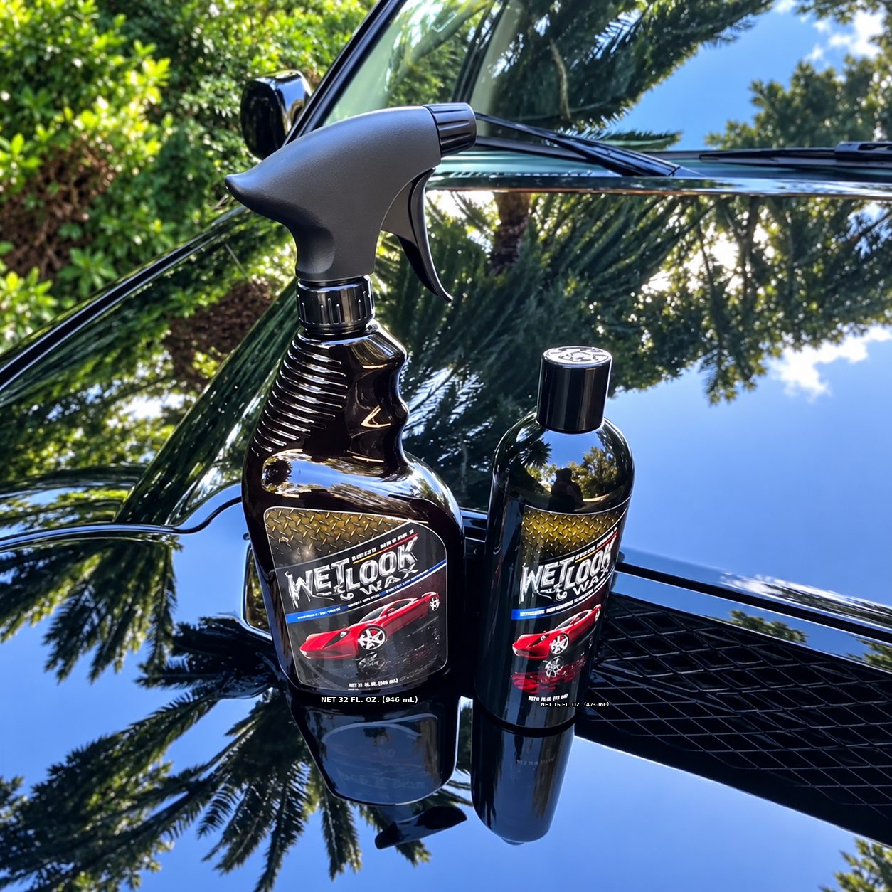 Wet Look Wax spray and liquid wax on a mirror-black hood reflecting palm trees
